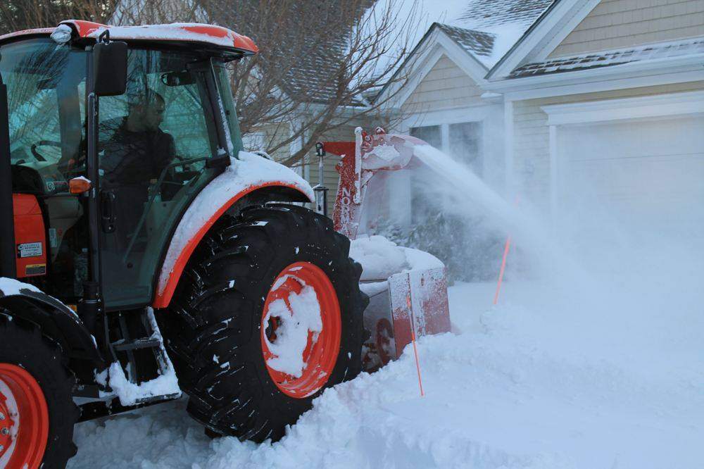Fairway tractor-mounted snowblower clearing deep snow